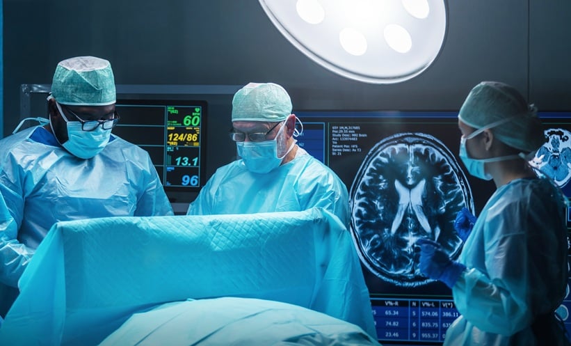 Surgeons performing brain surgery