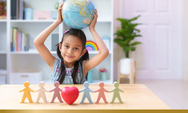 Smiling asian little girl holding globe model behind the people, heart.