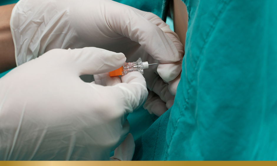 Person performing spinal tap or lumbar puncture
