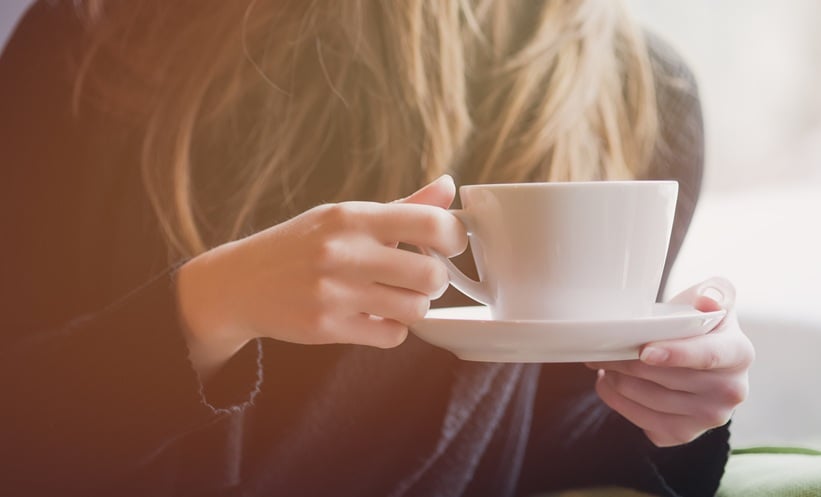 person drinking hot drink