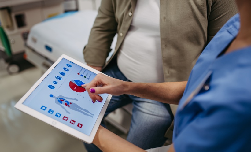 close up of female doctor consulting with overweight patient