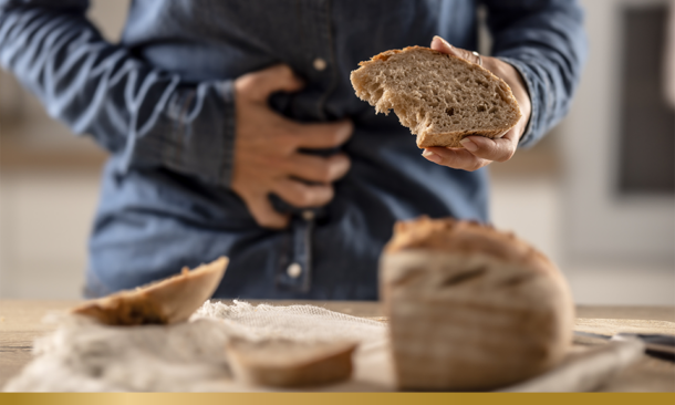 A young celiac woman suffers from abdominal pain after eating fresh bread