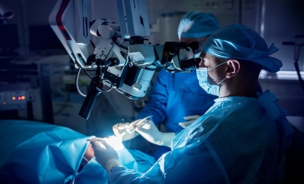 surgeons removing brain tumor through surgery
