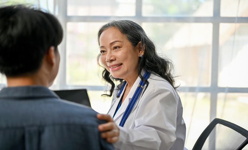 Female healthcare professional consulting with a patient about long-acting HIV treatment.