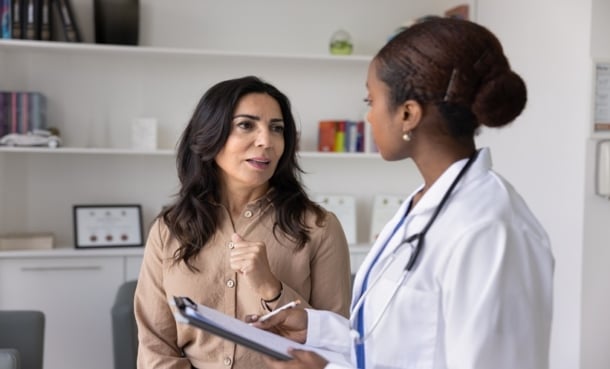 Woman consulting with a doctor.