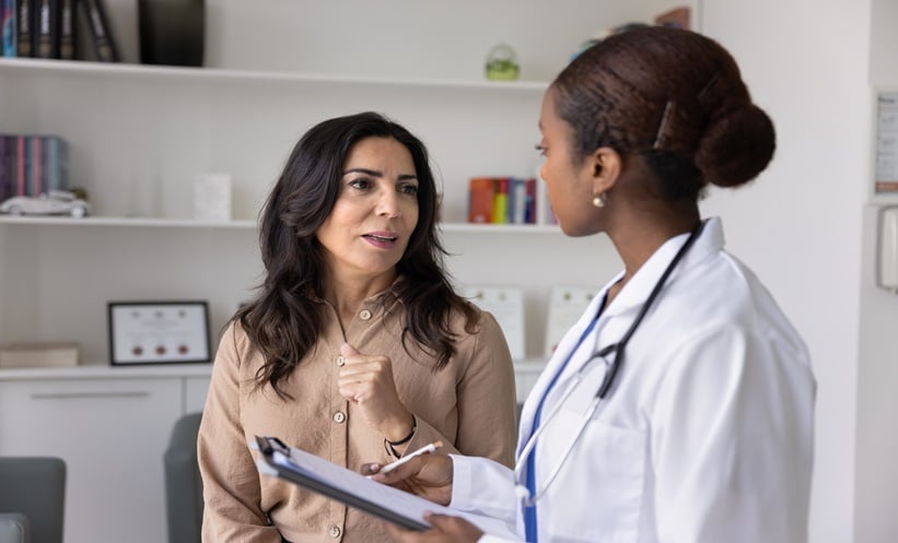 Woman consulting with a doctor.