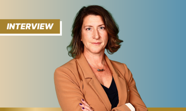 Headshot of Kate Nichol on yellow and blue background with a gold tab 'Interview'