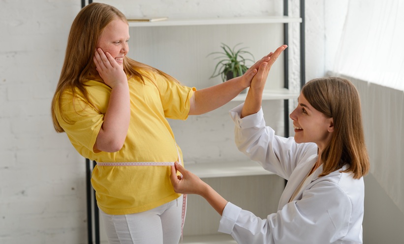 overweight child high fives her docotor after losing weight - GLP1 drugs